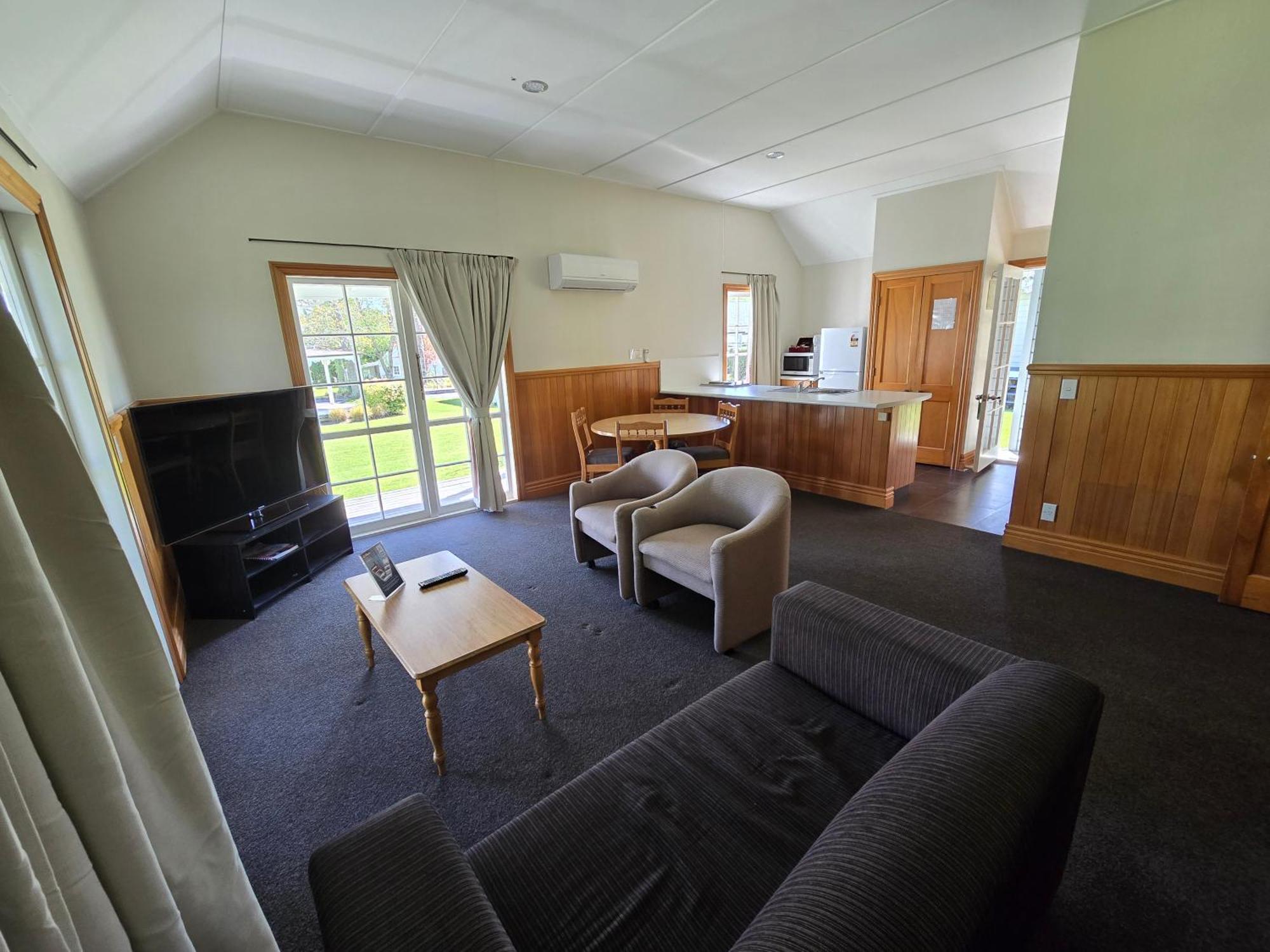 Huka Falls Resort Taupo Exterior photo Living area of a two bedroom cottage